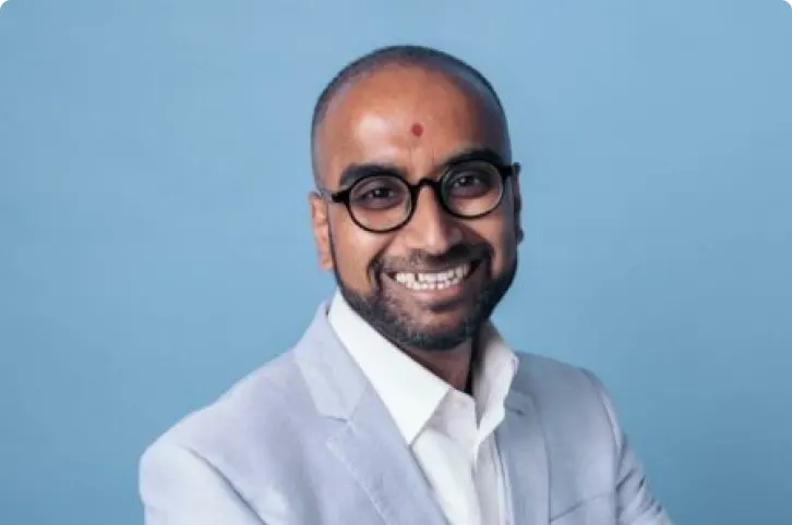 Barings Law Practice Manager Anil Kara on a blue background