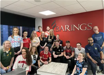 Careers Barings Law image - Barings Law Team photo all wearing sports shirts for a charity day