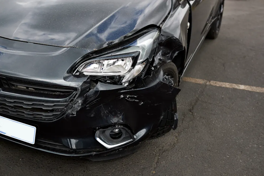 Have you bought a faulty car on finance? featured image. Image shows a damaged exterior of a car to the headlight and bumper.