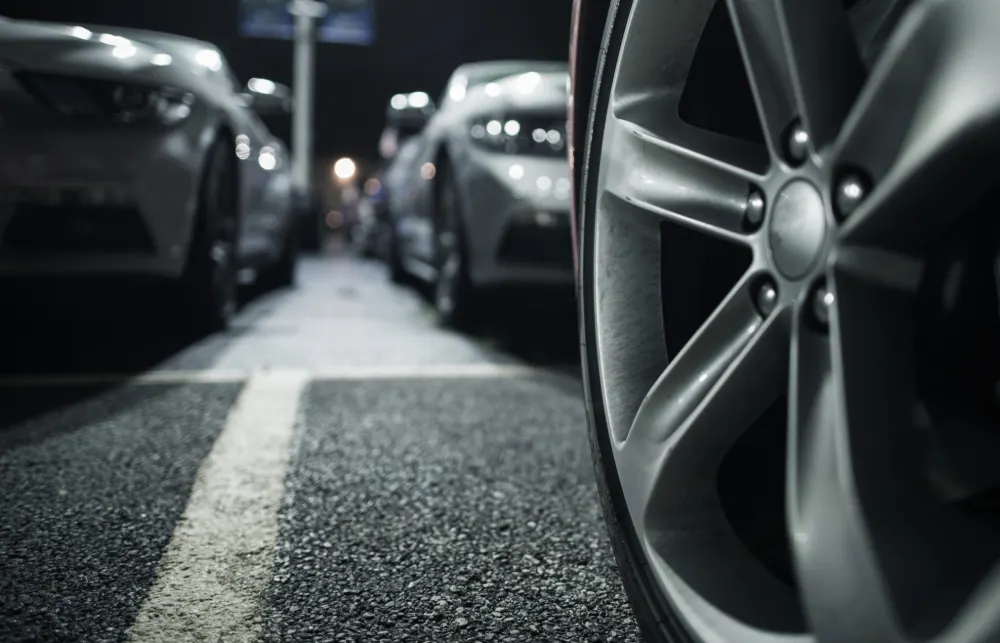 New rules to save UK car buyers millions - Image shows a close up of a wheel of a parked car.