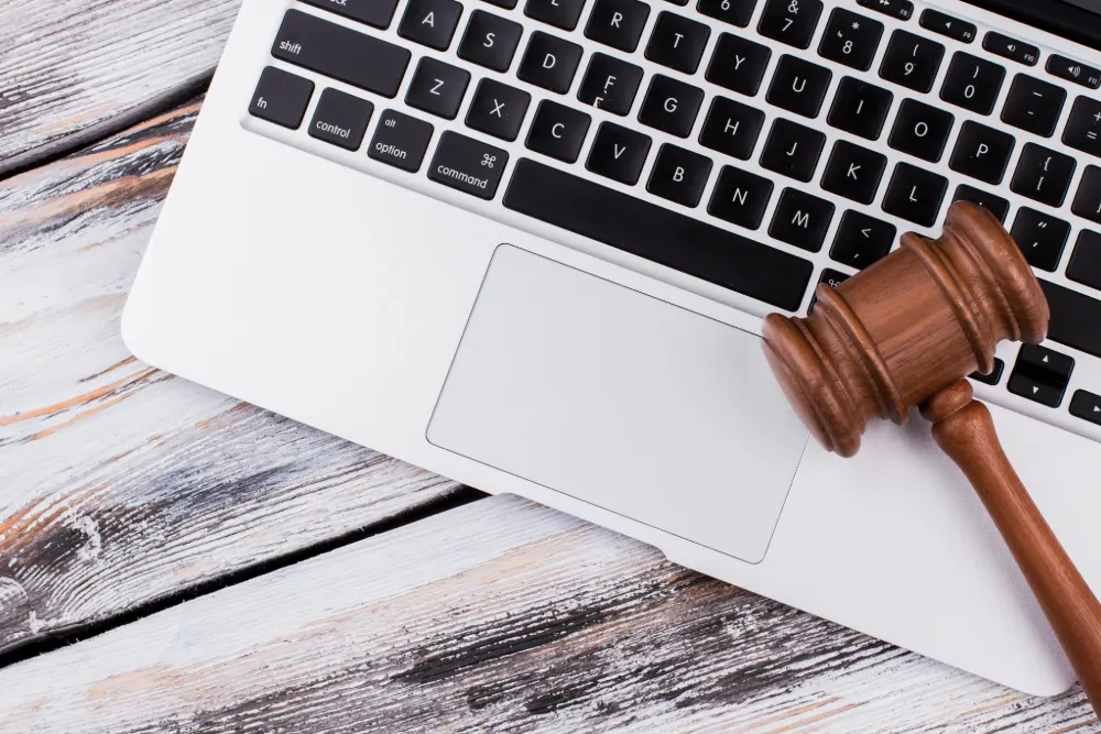 Law Firm Modernisation featured image. A wooden gavel sits on top of a white laptop.