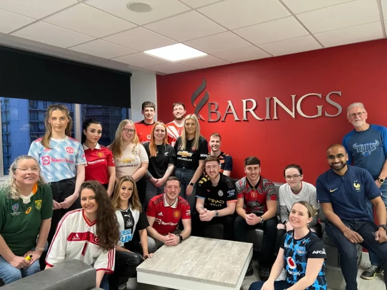 Barings Law employees wearing sport shirts for charity event to raise money for a local charity.