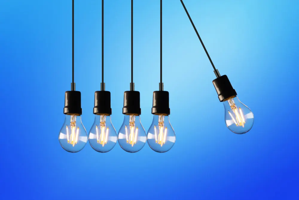 Energy Crisis featured image. Five hanging lightbulbs.