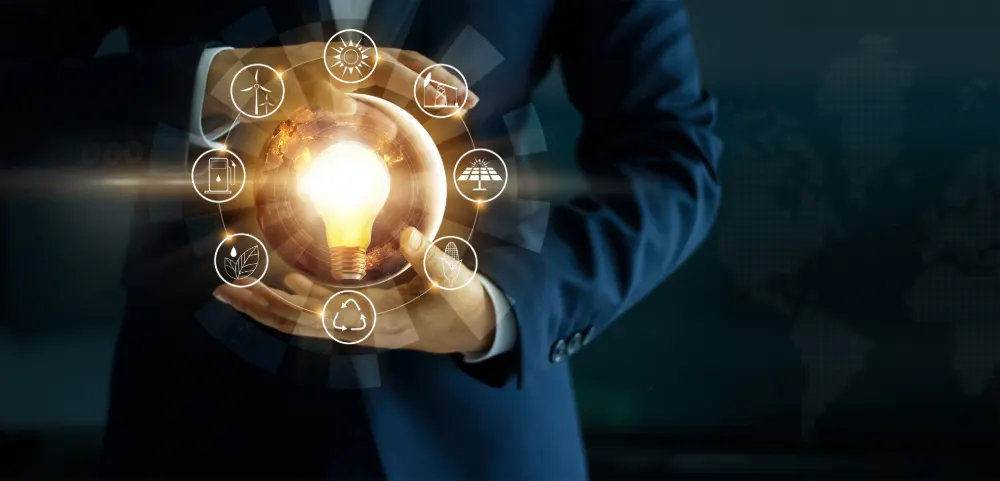 Business Energy - Energy Intensive Business Featured Image. Image shows male hands holding a lightbulb