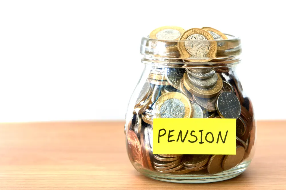 Mis-sold Pensions - The tell-tale signs featured image. Image shows a jar filled with UK coins with a post-it note saying 'pensions' on it in black marker.