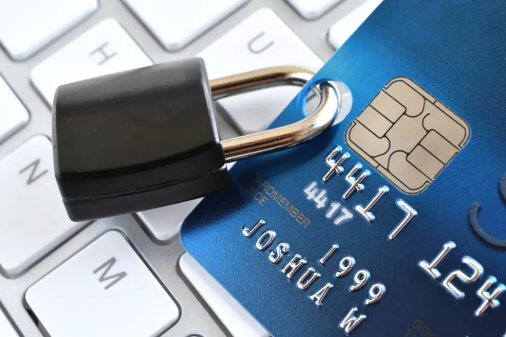 Legal Precedents in APP Fraud featured image. Image Details: A locked padlock on a credit card on a computer keyboard